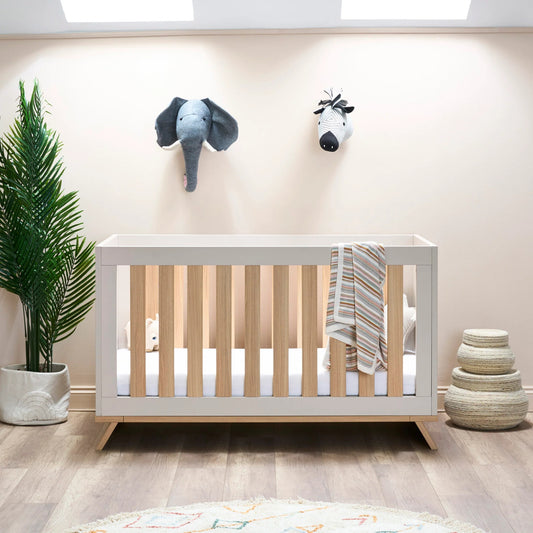 Obaby Thea cot bed latte adjustable wooden cot bed in a modern nursery setting